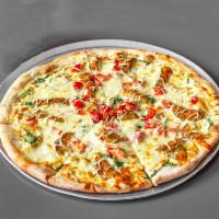 Romana Gourmet Pizza · A white pizza with eggplant, roasted red peppers, spinach, mozzarella, ricotta, and aged Rom...