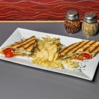 Chicken Pesto Panini  · Chicken, pesto sauce, artichokes, roasted red peppers, and mozzarella cheese on a grilled fl...