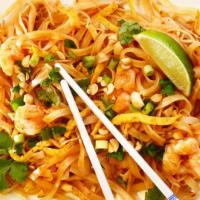 18. Pad Thai Noodles · Thin rice noodles stir-fried with bean sprouts, scallions, crushed peanuts, diced red tofu a...