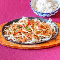 Sizzling Ginger · Stir-fried onions, bell peppers and sliced ginger in a sweet sesame sauce. Served on an iron...