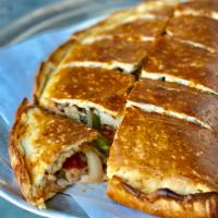 Calzone Pizza · Crust stuffed with three different cheeses, grilled bell peppers, mushrooms and onions.