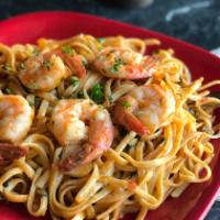 Linguini with Shrimp · With white wine sauce, fresh garlic and tomatoes. Served with garlic bread.