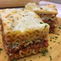 Beef Lasagna · Layered with meat sauce, ricotta, mozzarella, and Parmesan cheese Served with garlic bread.