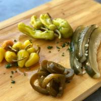 Pickled Chili Peppers · Yellow chili peppers, jalapenos, pepperoncini or pickles.