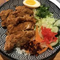Katsu Rice Bowl · Tempura fried crispy pork or chicken cutlet. Served with cabbage salad in house katsu or cur...
