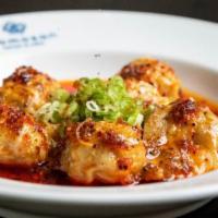 Spicy Wontons · Steamed chicken dumplings and Szechuan sesame chili