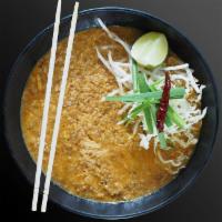 Mee Ka Tee · Curry rice noodle with coconut spicy curry, grounded pork, egg, onions, peanuts on top with ...