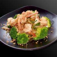 Pad Garlic · Garlic sauce with meat and onions bed on steamed broccoli served with rice.