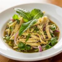 Bamboo Shoot Larb Salad · Light and spicy salad served warm with mints, shallots, scallions, cilantro, roasted rice po...