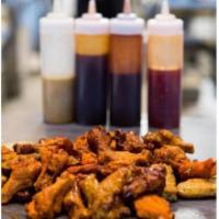 Buffalo Wings · All natural, Halal, hormone free jumbo wings with your choice of  awesome signature flavor a...