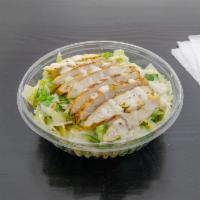 Chicken Caesar Salad · Grilled chicken drizzled in Caesar dressing, served over lettuce, tomato, onions, crispy tor...