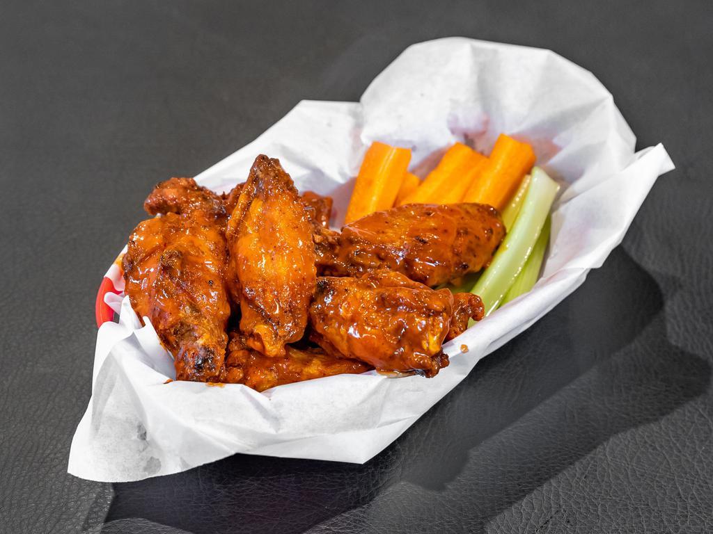 Wings · Buffalo, BBQ, or dry. Includes 1 dressing or sauce.