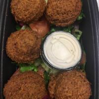Falafel App · A blend of chickpeas, fava beans, our special spices served with tahini sauce, served with p...