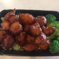 Sweet and Sour Chicken · White rice, broccoli, cabbage, chicken nuggets with sweet and sour sauce.