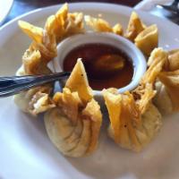 Crab Wontons · 6 pieces. Crispy wonton stuffed with crab meat and cream cheese served with plum sauce.