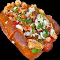 Tapatio Dog · 100% all beef dog wrapped in center cut bacon. In the bun: creamy serrano spread. On the dog...