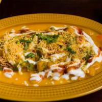 Ragda Patties · Pan-fried potato patties with a blanket of chickpeas drenched in yogurt and topped with chut...