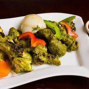 Hariyali Kabab · Boneless spring chicken marinated overnight in a mint-cilantro marinade, roasted in a tandoo...