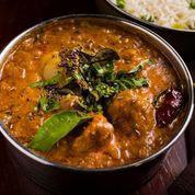Chettinad Murgh · Chicken marinated in mustard seed, red chili, cumin, and coriander, prepared in onion and tomato gravy topped with curry leaves and dried red chili.