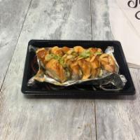 Alsaka Roll · Inside crab, avocado, and cream cheese. Outside baked salmon and green onion.