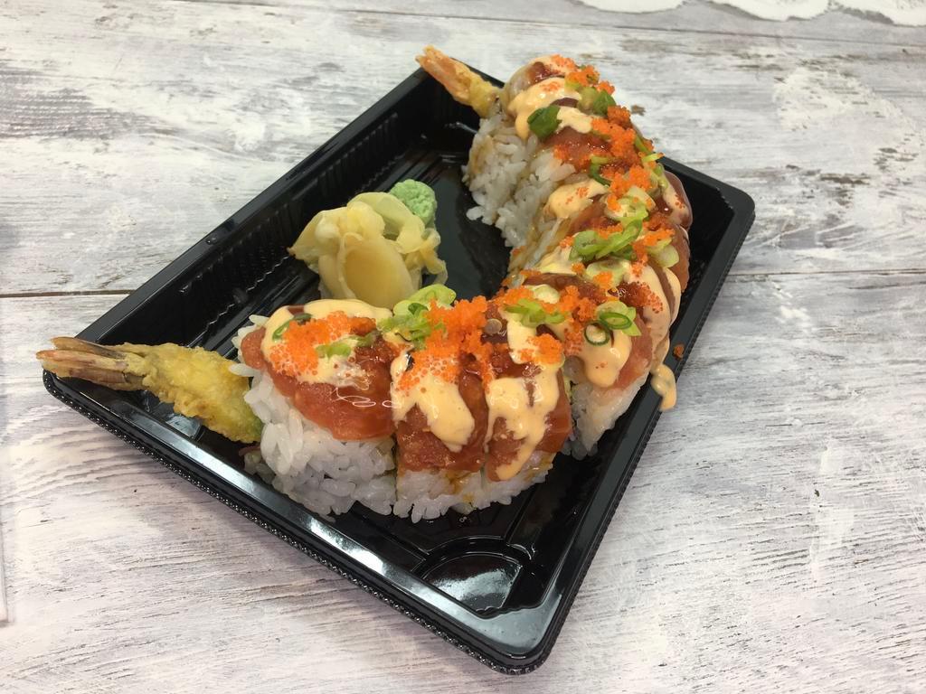 Hot Night Roll · Inside stuffed with shrimp tempura, crab, and avocado. Outside spicy tuna, smelt egg, and green onion.