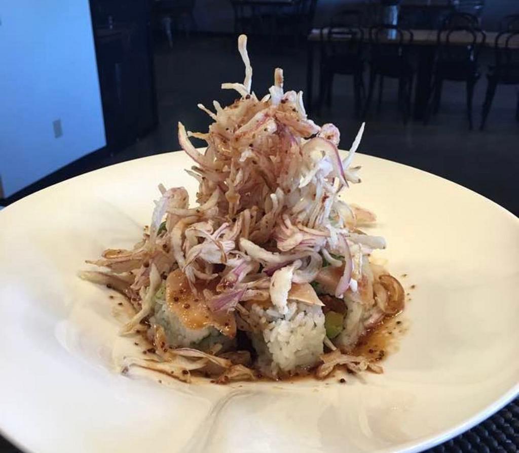 Blossom Roll · Inside stuffed with spicy tuna, cucumber, and avocado. Outside albacore, avocado, and deep fried onion.