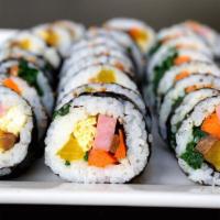 32. Kimbap · Made with fish cake, crab meat, carrot, egg and spinach rolled with roasted seaweed