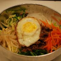 7. Bibim Bap · Rice dish with various vegetables, spicy sauce, beef and topped with fried egg.