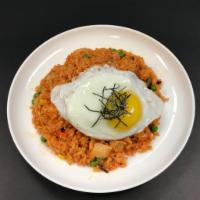 17. Kimchi Bokeum Bap · Stir fried rice with kimchi, mixed vegetables and topped with fried egg.
