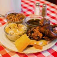 Half Chicken · Served with 2 sides, a honey corn bread and a drink.