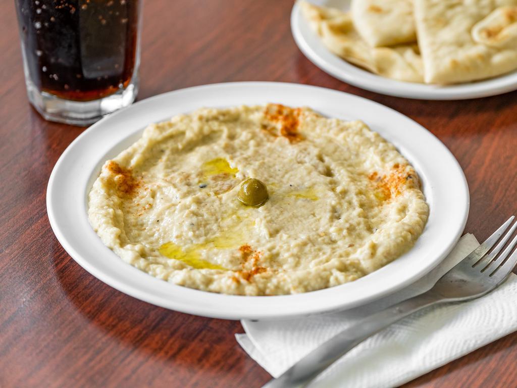 Baba Ghanouj Plate · Roasted eggplants tahini, lemon juice, garlic, garnished with olive oil, paprika and black olives. Add lamb or chicken gyro meat for an additional charge.