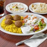 Falafel Platter · Falafel balls served with basmati rice, Greek salad, side of hummus with pita bread. Vegan o...
