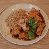 General Tso's Chicken · Batter fried chicken, onions, carrots and green peppers in a mildly spicy sauce served with ...