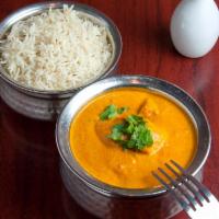 Chicken Tikka Masala · Clay oven cooked white meat and tomato light cream sauce. Served with basmati rice.