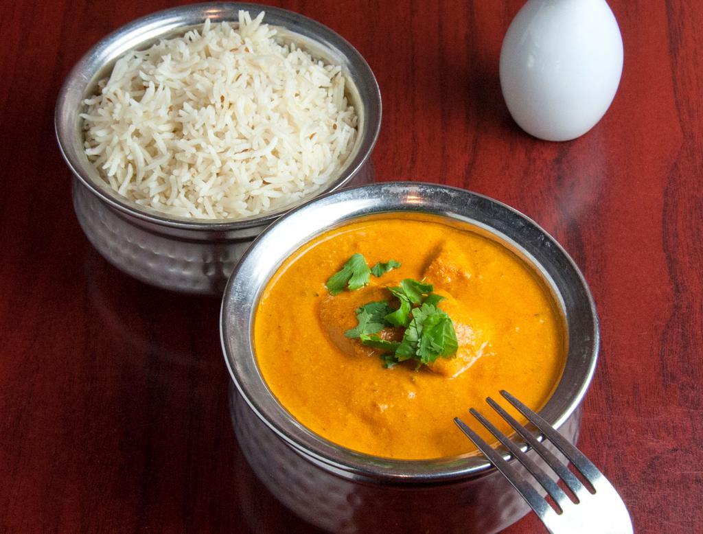 Chicken Tikka Masala · Clay oven cooked white meat and tomato light cream sauce. Served with basmati rice.
