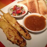 Chicken Satay · Skewers of chicken marinated in Thai herbs, grilled and served with peanut sauce and cucumbe...