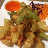 Veggie Tempura · Deep fried assortment of veggie served with sweet and sour sauce. 