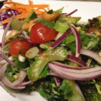 Brussels Sprout Salad · Deep fried brussels sprouts topped with mixed cashew nuts, onion, carrot and cilantro in Tha...