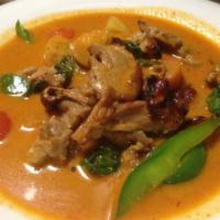 Roasted Duck Curry  🌶 · Sliced roasted duck in red curry sauce and coconut milk with bell peppers, tomatoes, pineapp...