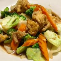 Pad Mixed Vegetables Jae · Stir fried tofu with garlic, broccoli, snow pea, cabbage, and carrot in special brown sauce.