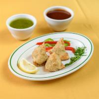 Vegetable Samosas · 3 pieces. Tasty pastry shells stuffed with potatoes, peas, and spices.