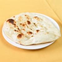 Tandoori Naan · Traditional unleavened bread baked in our clay oven.