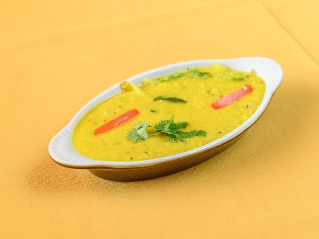 Daal Tadka · Yellow mung beans cooked with tomatoes, onion, garlic, spices and herbs.