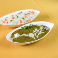 Palak Paneer · Chunks of homemade cheese cooked in a creamy spinach sauce with rich herbs and spices.