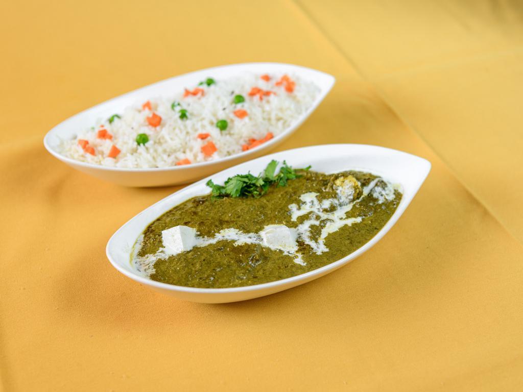 Palak Paneer · Chunks of homemade cheese cooked in a creamy spinach sauce with rich herbs and spices.