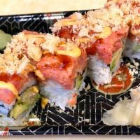 Chef Pauls Surprise Roll · Shrimp tempura inside topped with spicy tuna and chefs special sauce. 