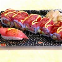 Spicy Girl Roll · Spicy tuna, avocado and cucumber inside topped with pepper tuna and chefs special sauce. 