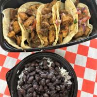 Pork Tacos  · Marinated  Pork Meat Seasoned with Purevian Herbs and Spices Cooked  Order Topped with Cilan...