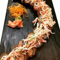 Vancouver Roll · Salmon, crab, shrimp, scallions, cream cheese topped with kani salad and eel sauce (breaded).