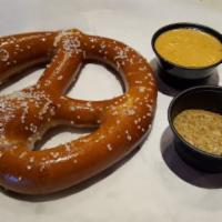 Bar Pretzel  · A single pretzel baked to a golden brown, served with a side of IPA mustard, and warm queso.